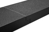A close-up view of the interlocking portion of the multi-piece car ramp system. The ramp is black with textured coating on a white background. 