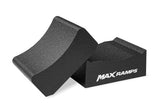 A black textured foam block with the brand name MAXRAMPS printed in white on one block, shown on a clean white background. This image shows how the 2 piece design functions.
