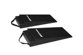 Two black MAX RAMPS ramps are shown on a clean white background, angled diagonally to display their textured surfaces and carrying handles.