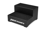A black two-step platform with a textured surface and the brand name 'MAXRAMPS' printed in white on the front step, set against a plain white background.