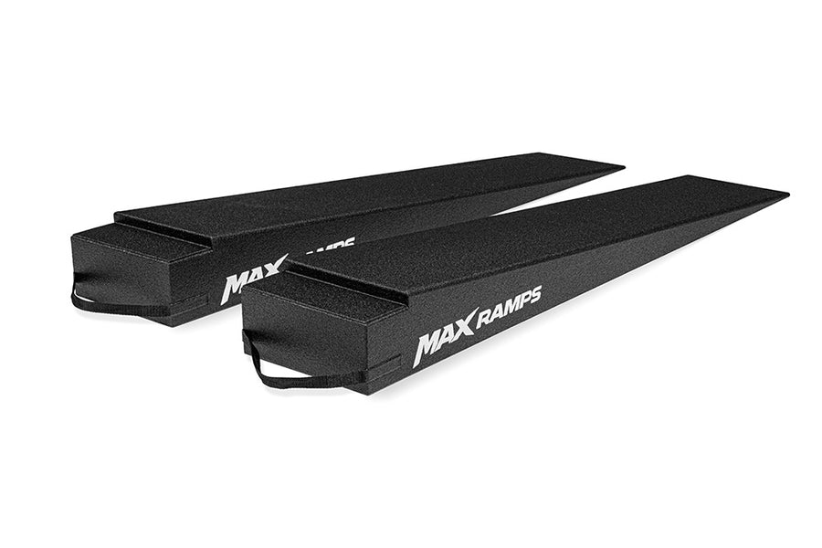 A pair of 7 inch high trailer ramps on a white background